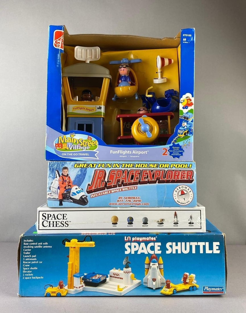 Group of 4 Space Themed Toys and More: Includes Main Street Village airport, inflatable shuttle, and more. Largest measures H 5 x W 13 1/2 x L 17 1/2 inches.