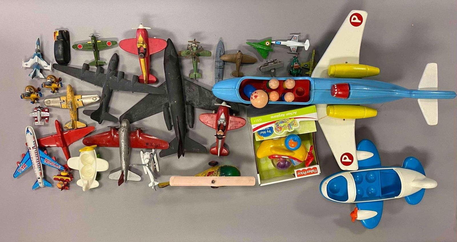 Group of Assorted Model Toys Planes and More: Includes Antique Toys, Die Cast Planes, and more. Largest measures 23 inches in length.