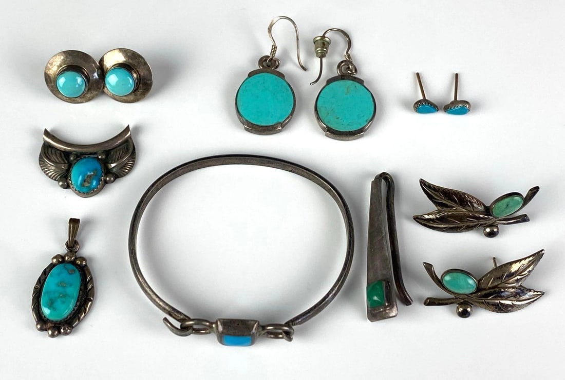 Group of Sterling Silver Native American Turquoise Jewelry: Includes cuff bracelet, earrings, tie clip and pendants, bracelet measures 1 3/4 inches H x 2 inches W
