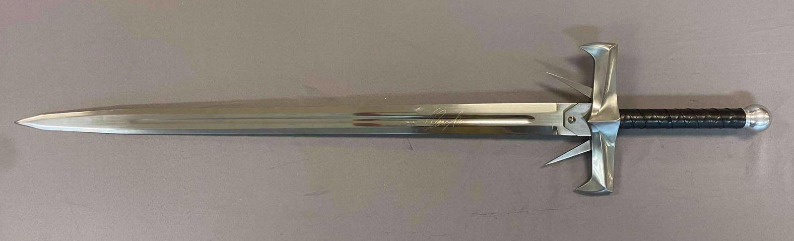 Davis Anderson licensed Highlander kurgan Broadsword: Made in Spain. Has etched Clancy Brown signature on blade. Measures 49 inches in length. Limited Edition 0281/1000.