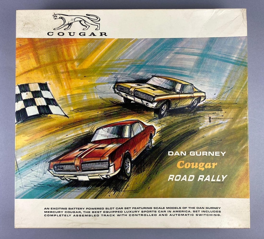 1967 NOS Dan Gurney Cougar Road Rally Dealer Promotional Slot Car Set: Like new in original packaging. Untested. Packaging measures H 2 x W 16 1/2 x L 17 1/2 inches. Battery operated.