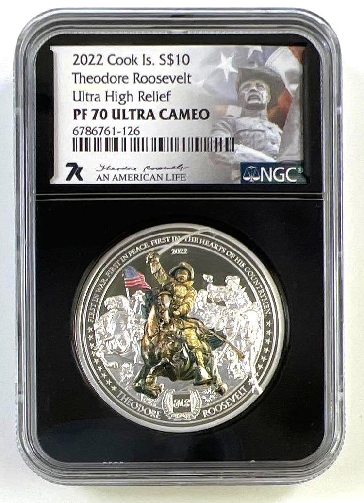 2022 Cook Islands Theodore Roosevelt An American Life 2 oz .999 Fine Silver PF70 UCAM Ultra High: 2022 Cook Islands $10 Theodore Roosevelt "An American Life" Ultra High Relief silver coin graded a perfect PF70 Ultra Cameo by NGC. This impressive collectible honors the life and legacy of Th