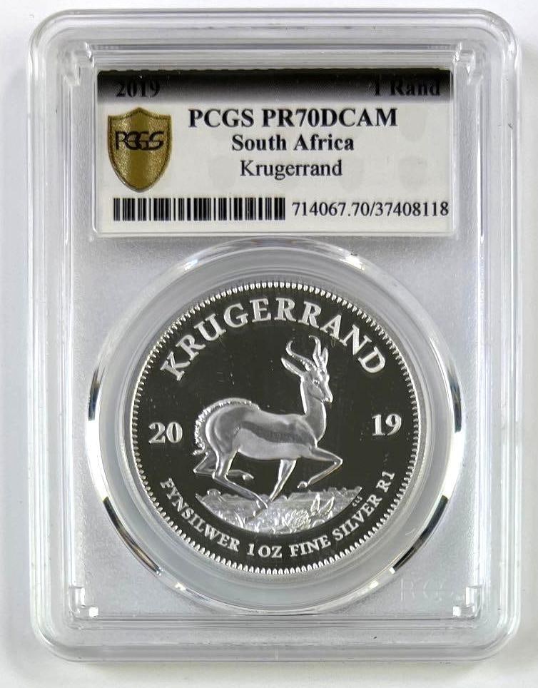2019 South Africa 1 Rand 1 oz Fine Silver Krugerrand Proof PR70DCAM PCGS Tumi Tsehlo Signed: Outstanding 2019 South Africa 1 Rand Krugerrand Proof struck in 1 Troy Ounce of Fine Silver. This beautiful proof issue features the iconic springbok antelope on the reverse and Paul Kruger on the obv