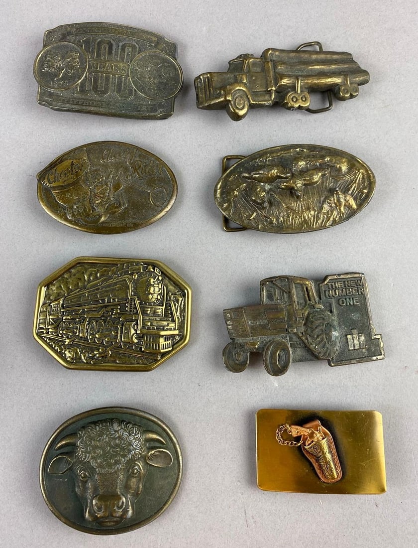 Group of 8 Brass Belt Buckles: Largest measure 3 inches in length.