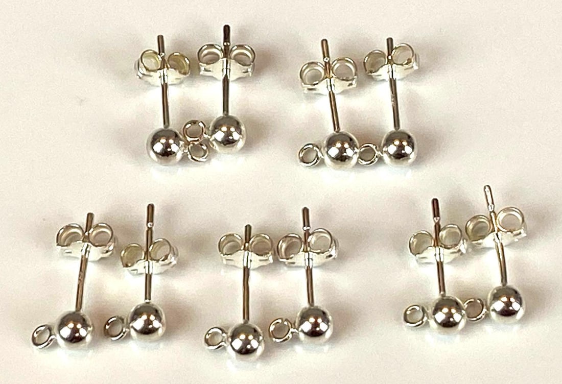 Group of 5 Pairs of Sterling Silver Stud Earrings: Each measures 1/2 inches In length