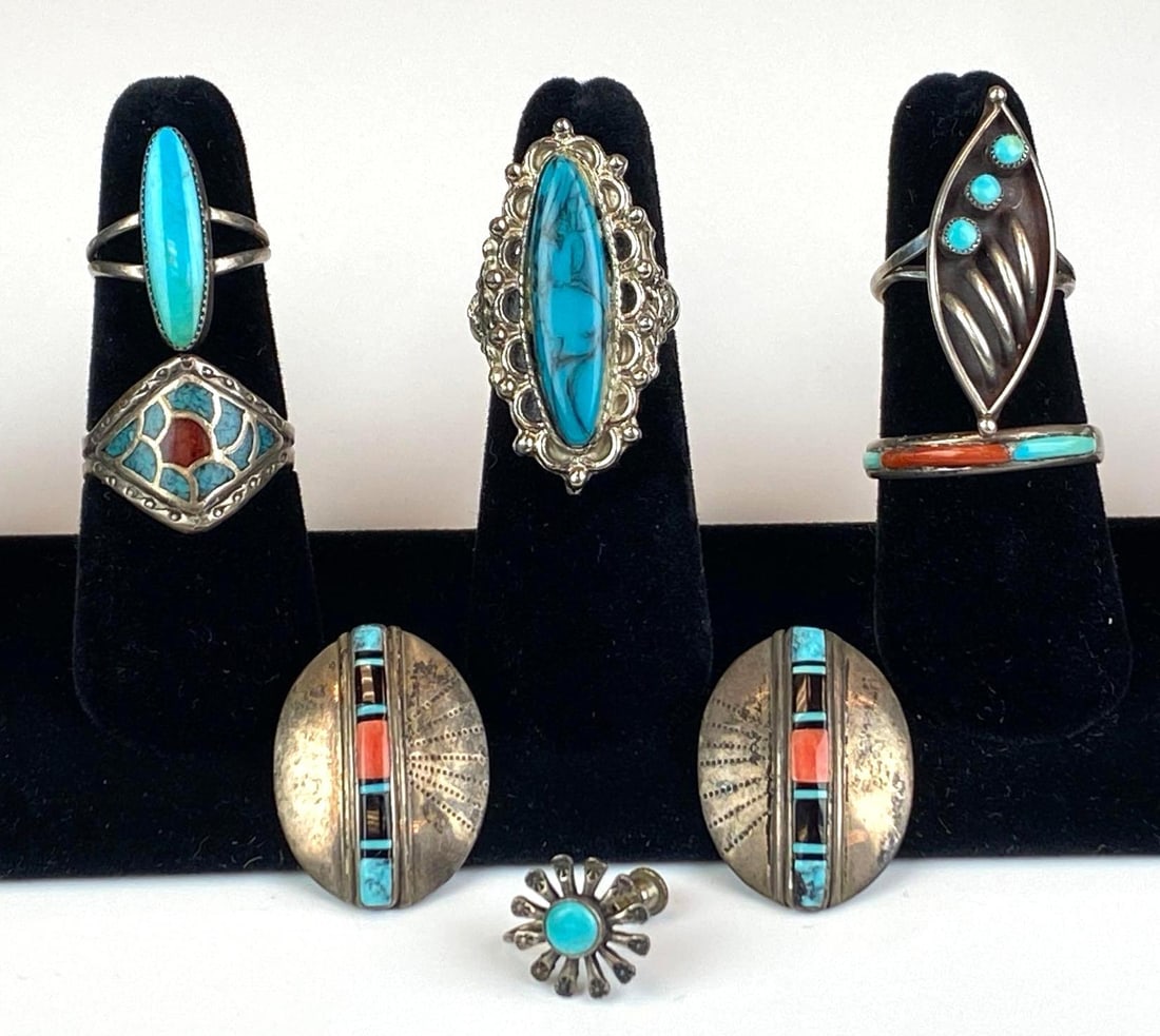 Group of 7 Sterling Silver Native American Turquoise Jewelry: Features some coral, includes 5 rings, a pair of earrings and 1 unmatched earring, ring sizes range from 6 - 10 1/2