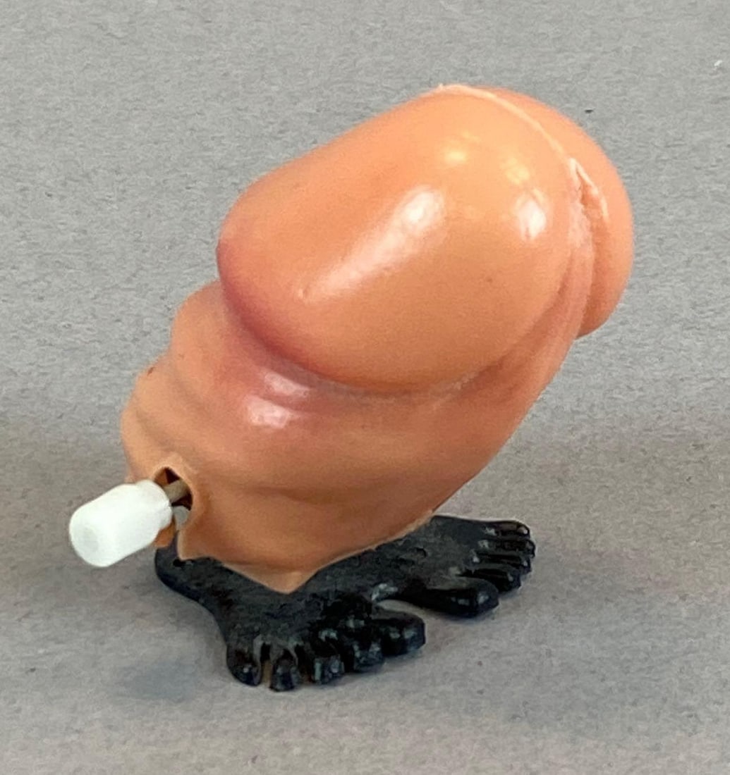 Novelty Gag Wind-Up Jumping Weiner: In working condition, measures 2 inches H x 1 3/4 inches W x 1 1/2 inches D