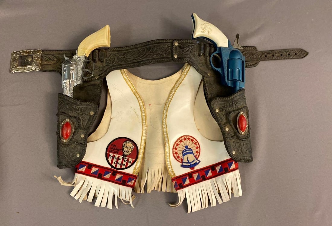 Kentucky Fried Chicken Western Hero Set: includes Belt, 2 6 shooters, and kfc themed toddler vest. Largest measures 13 inches in length.