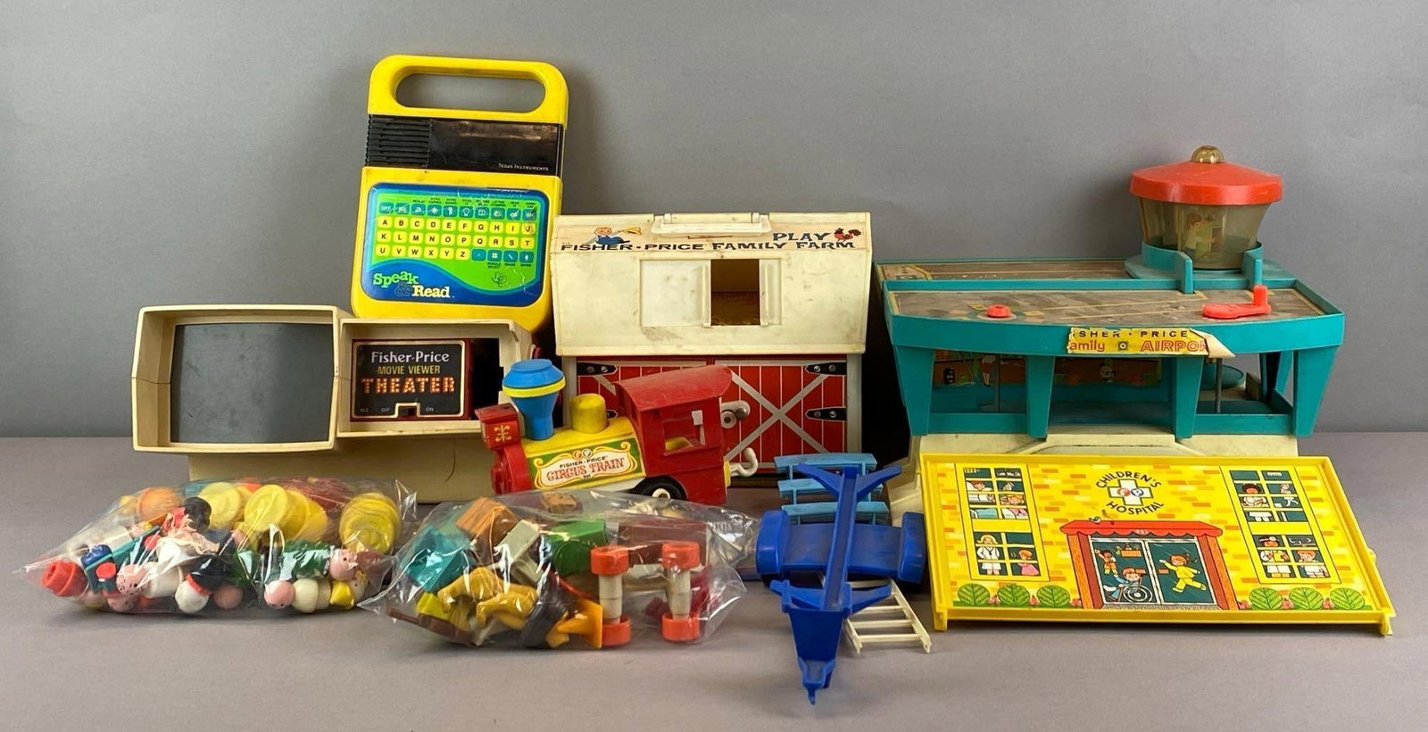 Group of Assorted Fisher Price Figurines and More: Includes family airport playset, farmily farm, vehicles, accessories and more, largest measures 11 inches H x 14 inches W x 14 inches D
