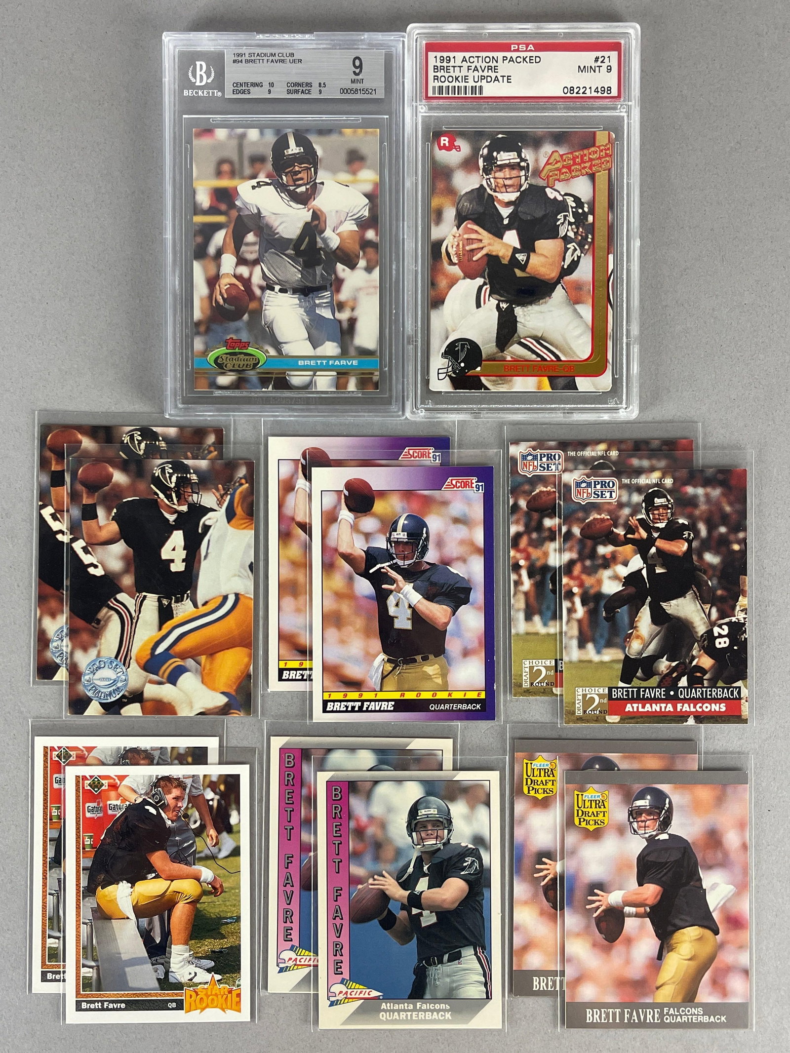 14 - 1991 Brett Favre Rookies with 2 - Graded 9s: 1991 Stadium Club #94 Rookie BGS 9, 1991 Action Packed Brett Favre Rookie Update #21PSA 9, 2 - of each of the other brands