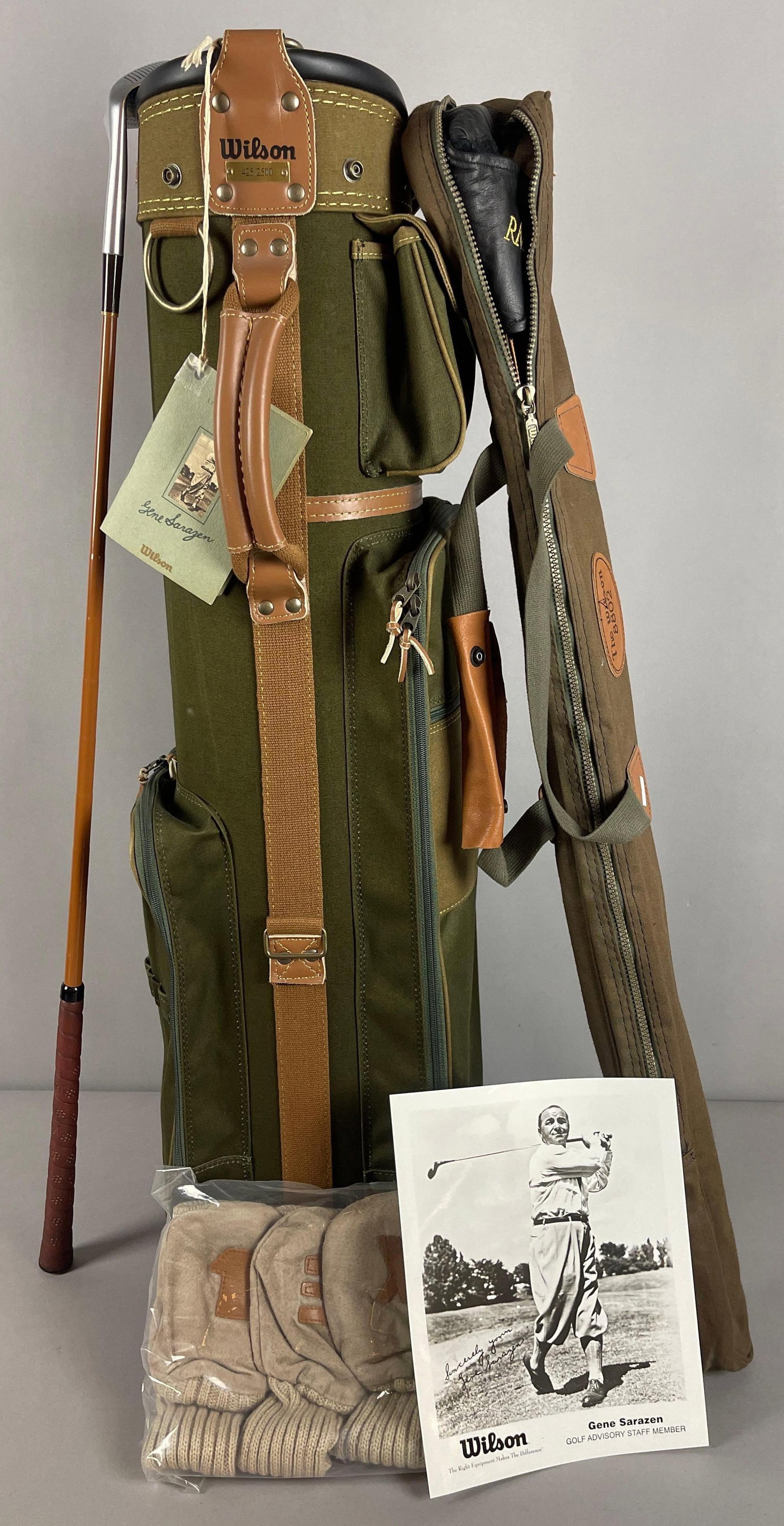 Wilson Gene Sarazen Commemorative Gold Bag 425/2500 + Gene Sarazen Sand Iron and Wilson 8802 RM: Great stylish gold bag that commemorates the style that the squire Gene Sarazen played with, 425/2500, Included is a Gene Sarazen Commemorative Sand Iron and a Wilson 8802 RM Putter /300, this was par