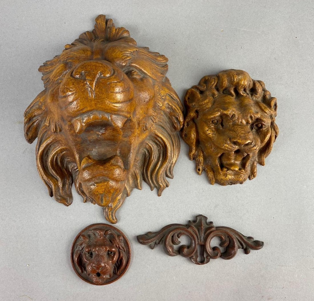 Group of 4 Modern Lion Head Hanging Wall Sculptures: Made from Compressed Sawdust. Largest measures L 9 1/2 x W 7 inches. Largest has chip on bottom