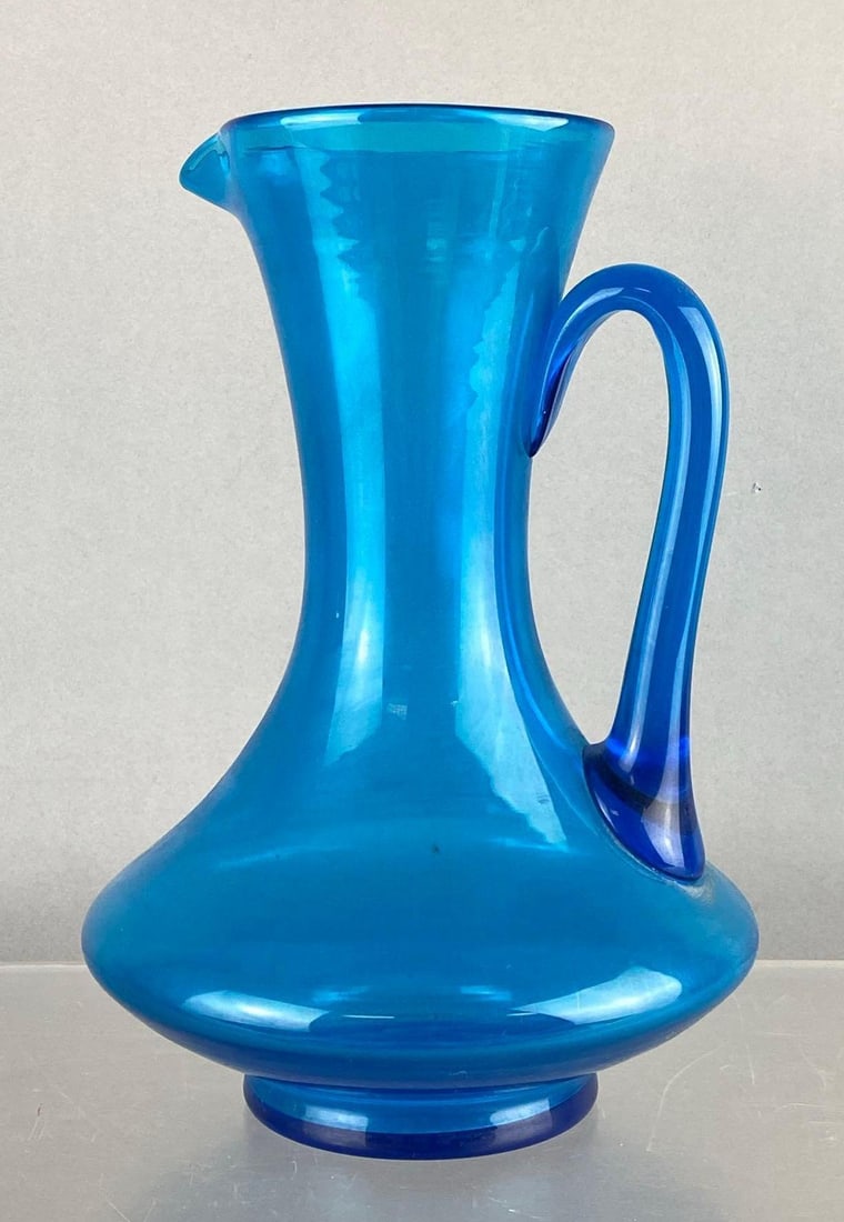 MCM Cobalt Blue Kingstown Style Hand Blown Glass Pitcher: With applied Glass Handle. Measures 10 inches tall.