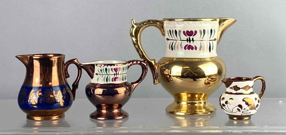 Group of 4 Antique English Copper Lusterware Pitchers: Largest measures 5 inches tall.