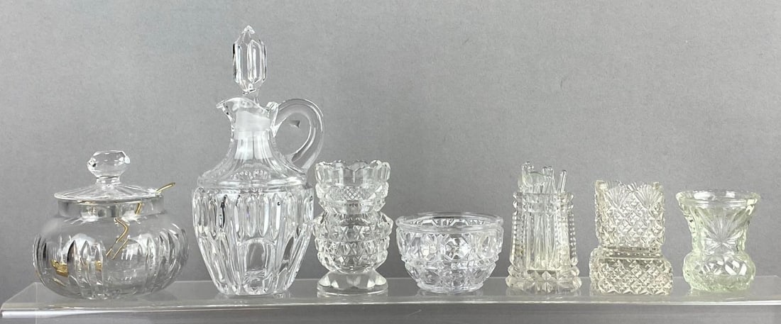 Group of 7 Cut/ Press Glass Items: Includes Sugarpot, decanter, and more. Largest measure 6 inches tall.