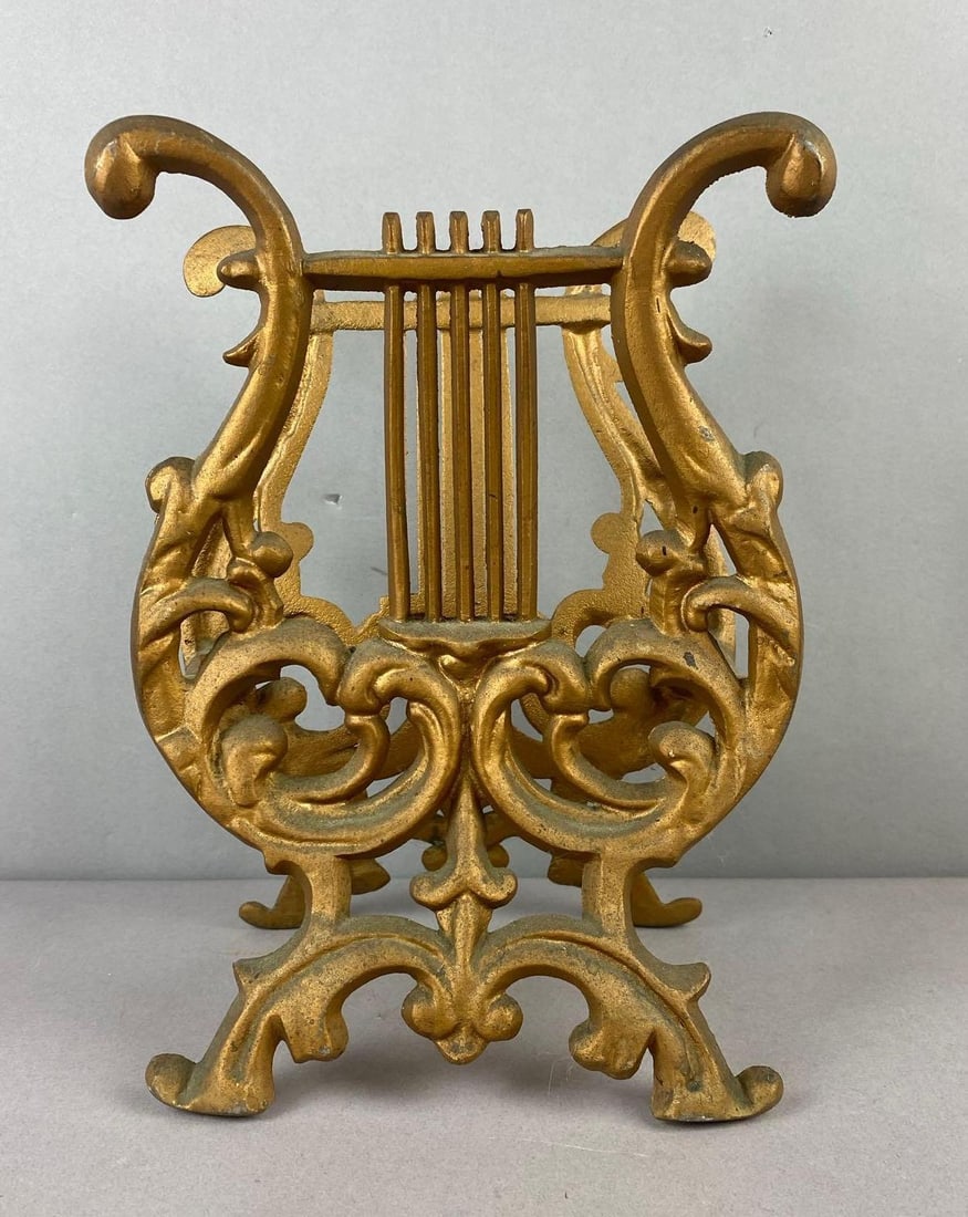 Lyre Harp Shaped Pot Metal Magazine Rack: Measures H 11 x W 3 1/2 x L 8 inches.