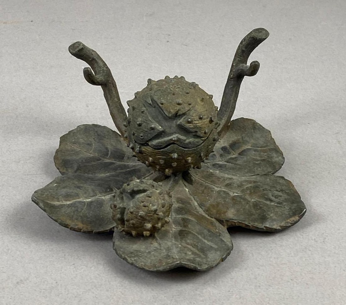 Antique Trompe L?oeil Chestnut Inkwell: has broken porcelain inkwell Inside. Measures H 3 x W 5 x L 6 inches.