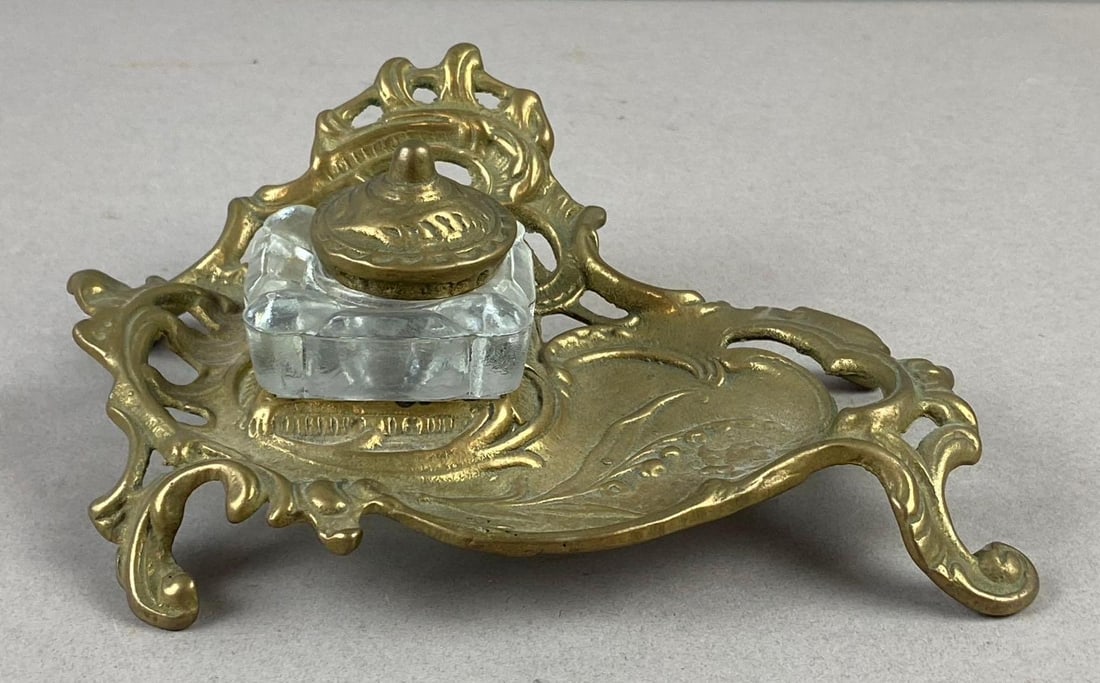 Antique Art Nouveau Brass Inkwell: Measure 7 inches in length.