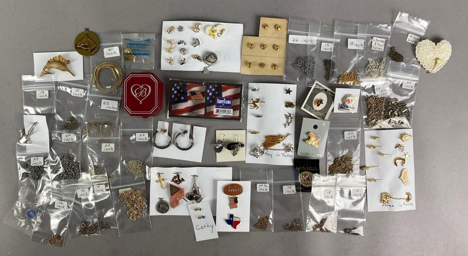 Group of Assorted Costume Jewelry: Includes pins, necklace, bracelet and more, largest necklace measures 24 inches in length