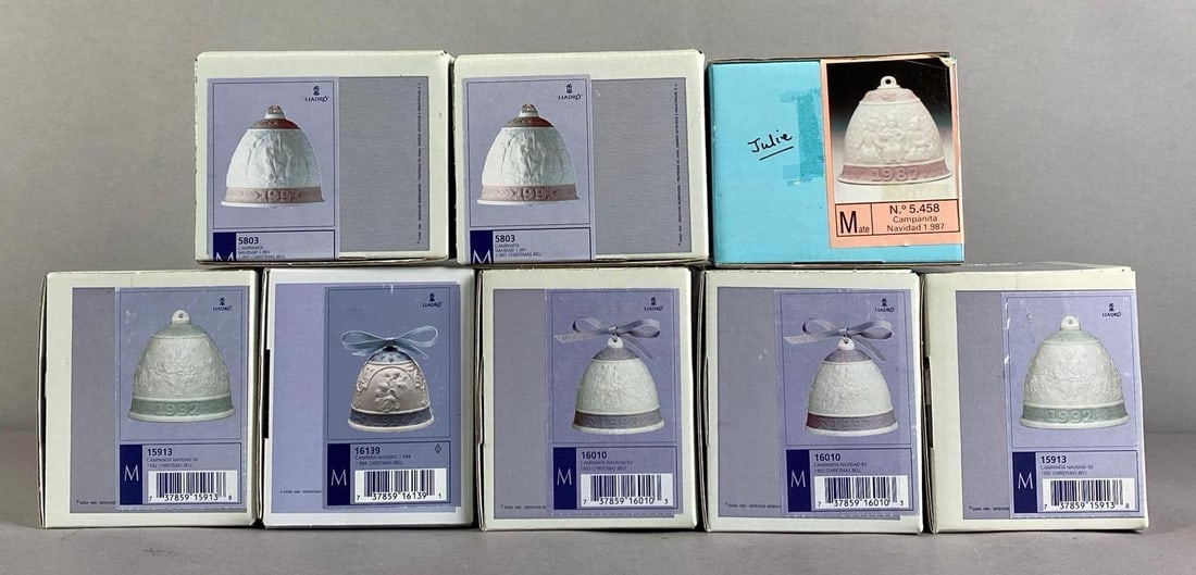 Group of 8 1980s - 1990s Lladro Porcelain Christmas Bells: like new in original boxes, each box measures 4 inches H x 4 1/2 inches W x 4 1/2 inches D