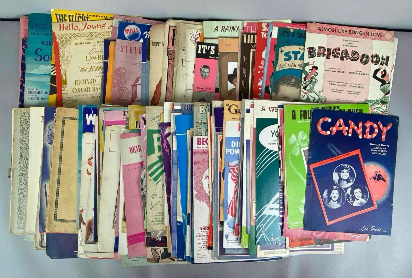 Group of Assorted Vintage Sheet Music Books: Includes Candy, Brigadoon, you you you and more, largest measures 12 inches H x 10 inches W