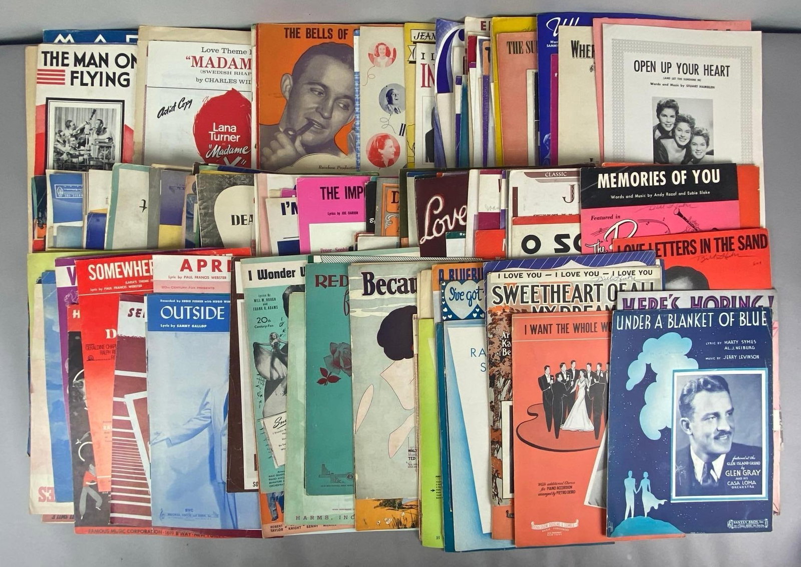 Group of Vintage Sheet Music Books: Includes under a blanket of blue, red roses for a blue lady, memories of you and more, largest measures 12 inches H x 10 inches W