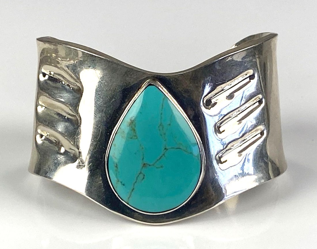 Mexican Sterling Silver Turquoise Tear Drop Cuff Bracelet: Total weight of 47.9 grams, 2 inches H, inner circumference measures 7 inches with a 1 1/2 inches opening