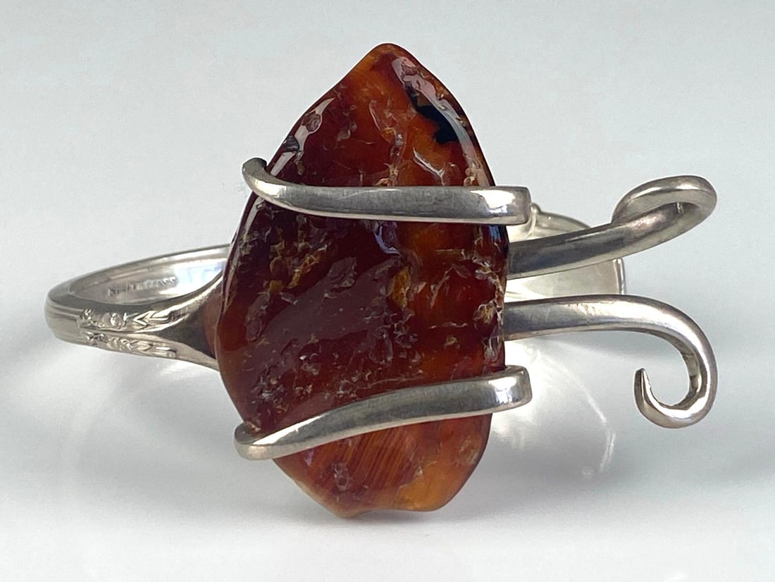 International Sterling Silver Fork Amber Cuff Bracelet: Total weight of 60.6 grams, enchantress pattern, 2 inches H, inner circumference measures 7 inches with a 1 1/2 inches opening
