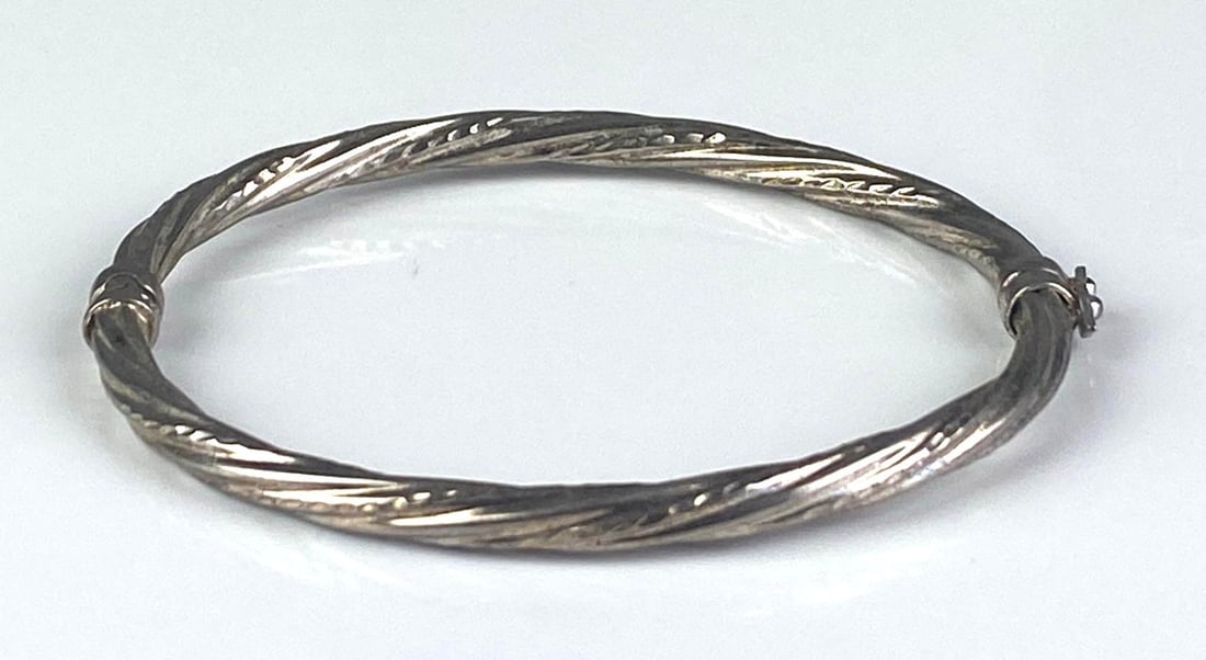 Sterling Silver Twisted Hinged Bangle: Measures 2 1/4 inches H x 2 1/2 inches W
