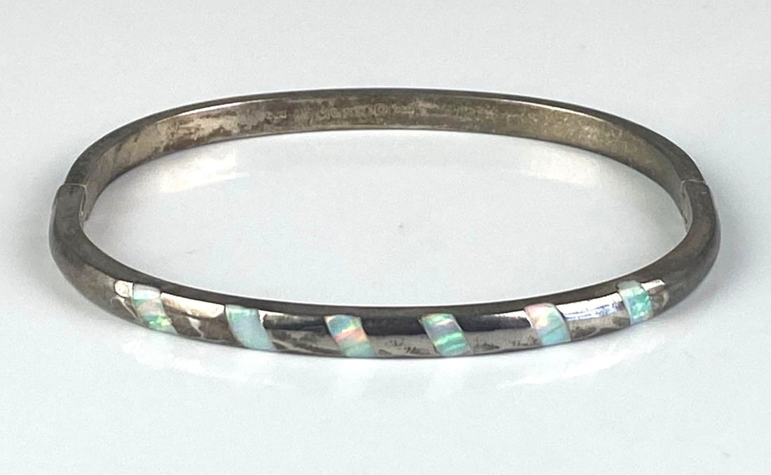 Mexican Sterling Silver Fire Opal Hinged Bangle: measures 2 1/4 inches H x 2 1/2 inches W