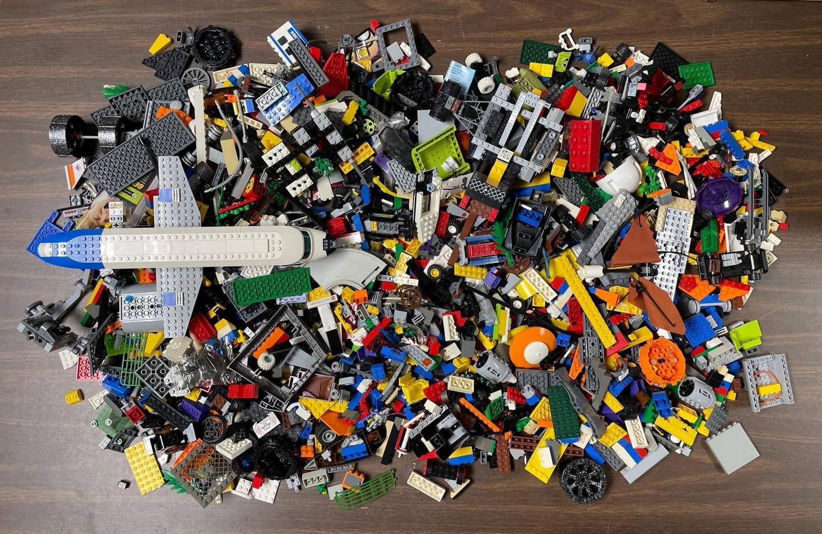 Large Group of Lego Pieces: Includes wheels, airplane