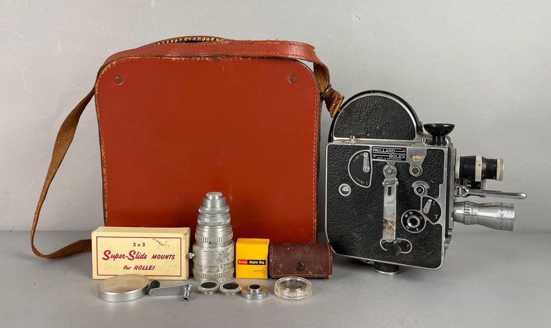 Vintage Paillard Bolex H16 16mm Movie Camera: Includes damaged leather case, accessories, case measures 10 1/2 inches x 10 1/2 inches x 6 inches