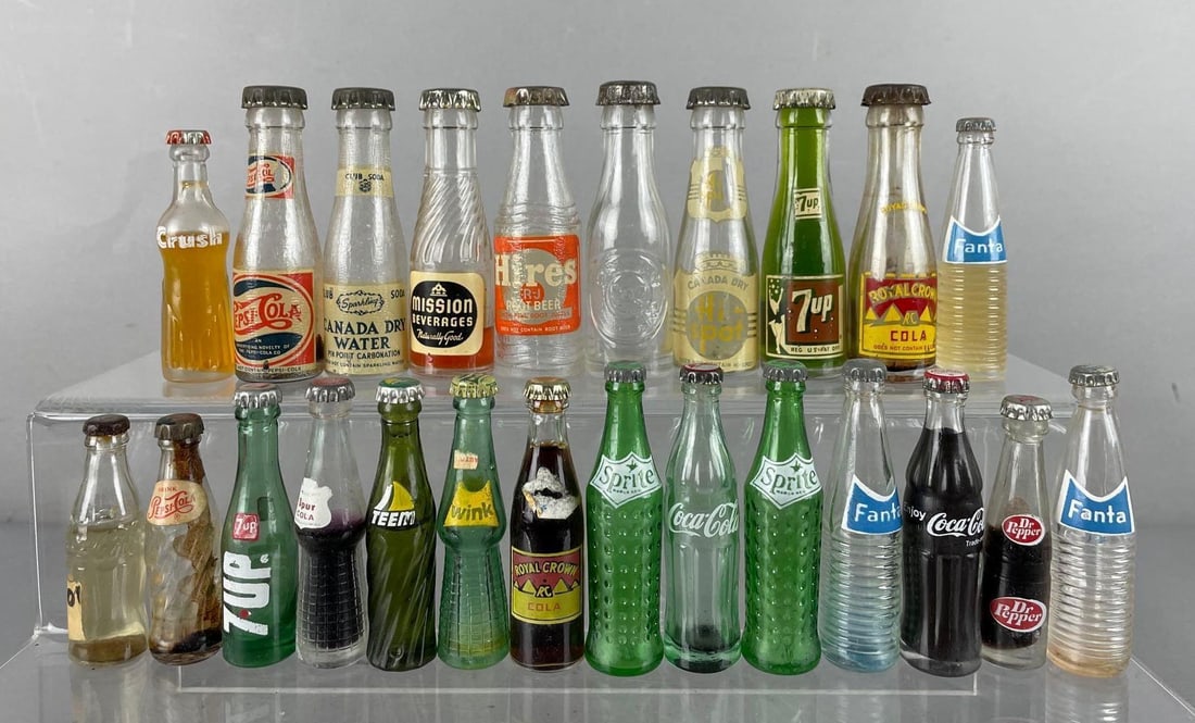 Group of Vintage Miniature Soda Bottles: Includes Coca-Cola, Pepsi, crush, Fanta, and more, tallest measures 3 3/4 inches