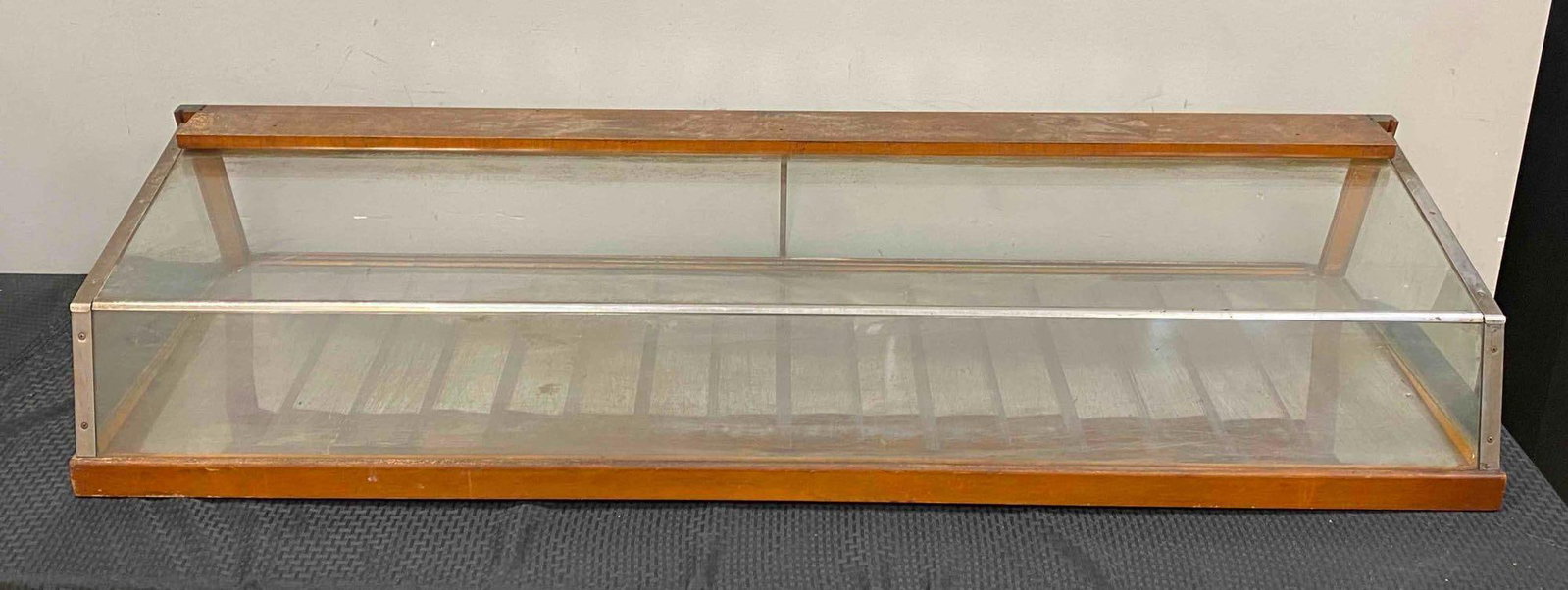 Vintage Wood and Glass Tabletop Display Showcase: NO IN HOUSE SHIPPING AVAILABLE, THIRD PARTY SHIPPING RECOMMENDED, original glass doors included, measures 12 1/2 inches H x 63 inches W x 22 1/2 inches D