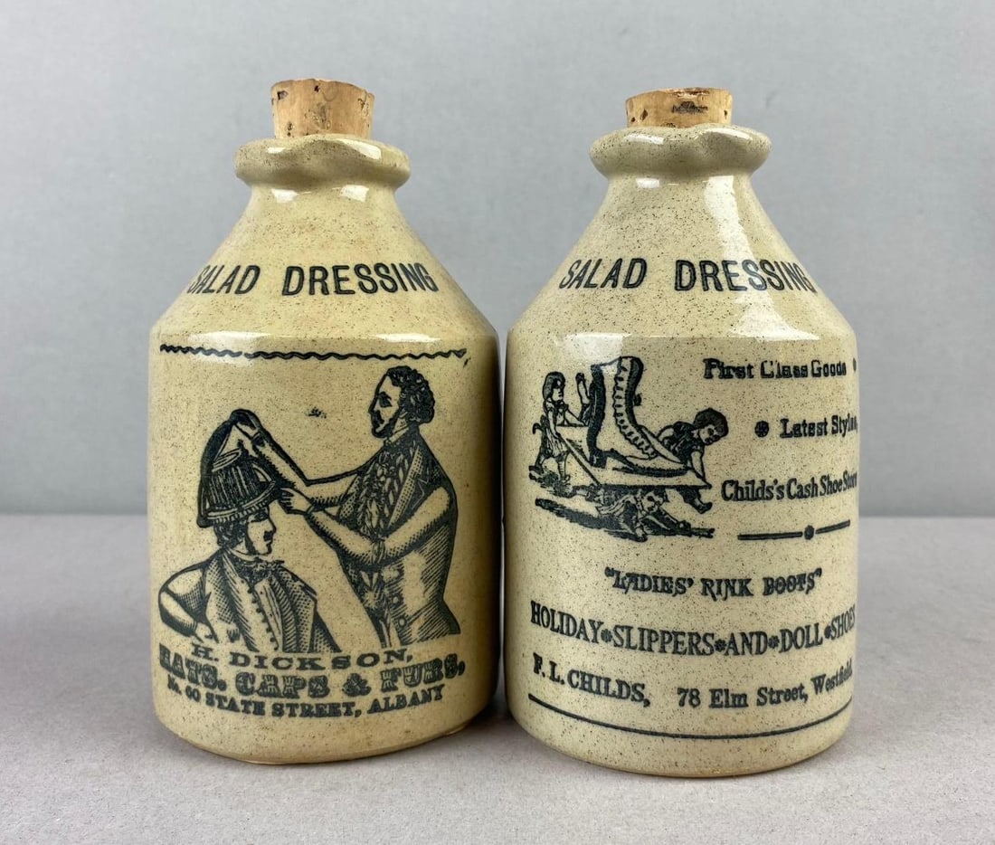 Group of 2 Vintage 1990s Salad Dressing Advertising Stoneware Crocks: Made in England largest measures 6 inches tall.