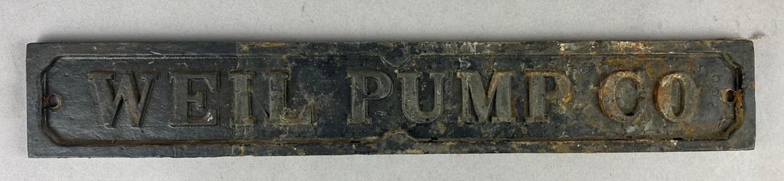 Antique Well Pump Co. Metal Wall Plaque: Measures L 18 x W 3 inches.