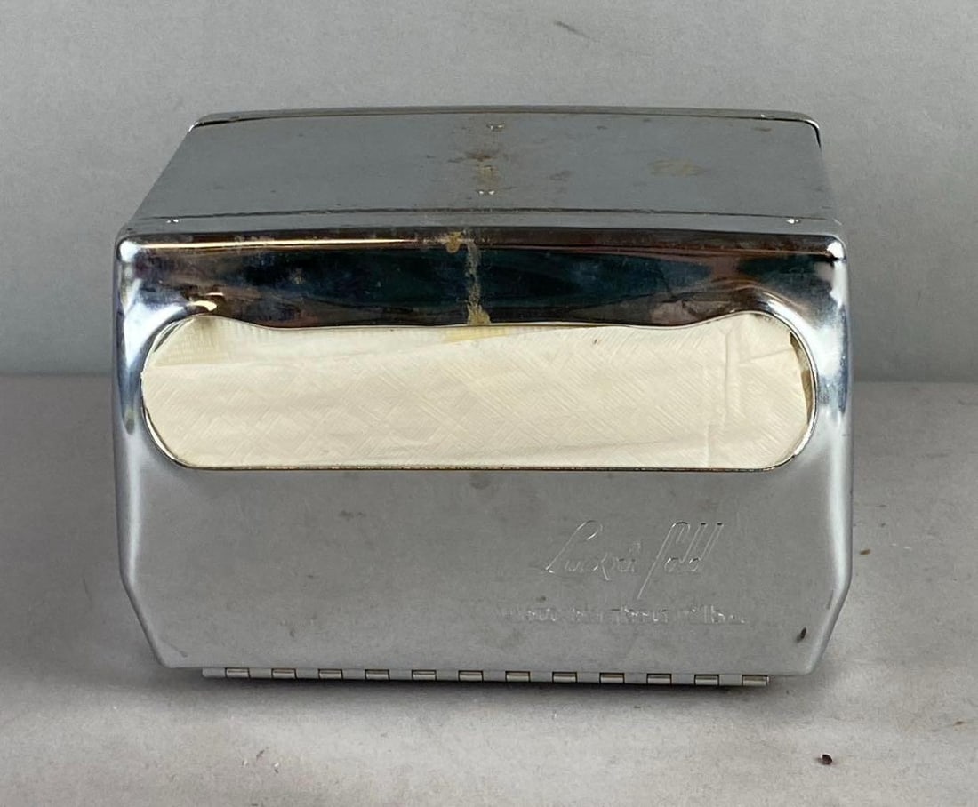 Vintage Luxufold Tabletop Napkin Holder: includes napkins. Measures H 5 x W 5 x L 7 1/2 inches.