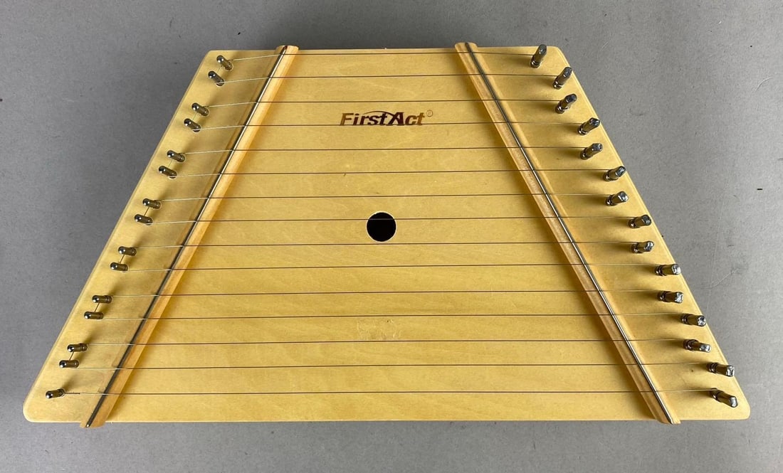 First Act Lap Hart Musical Instrument: Includes instructions and music. Measures H 2 x W 8 x L 15 inches.