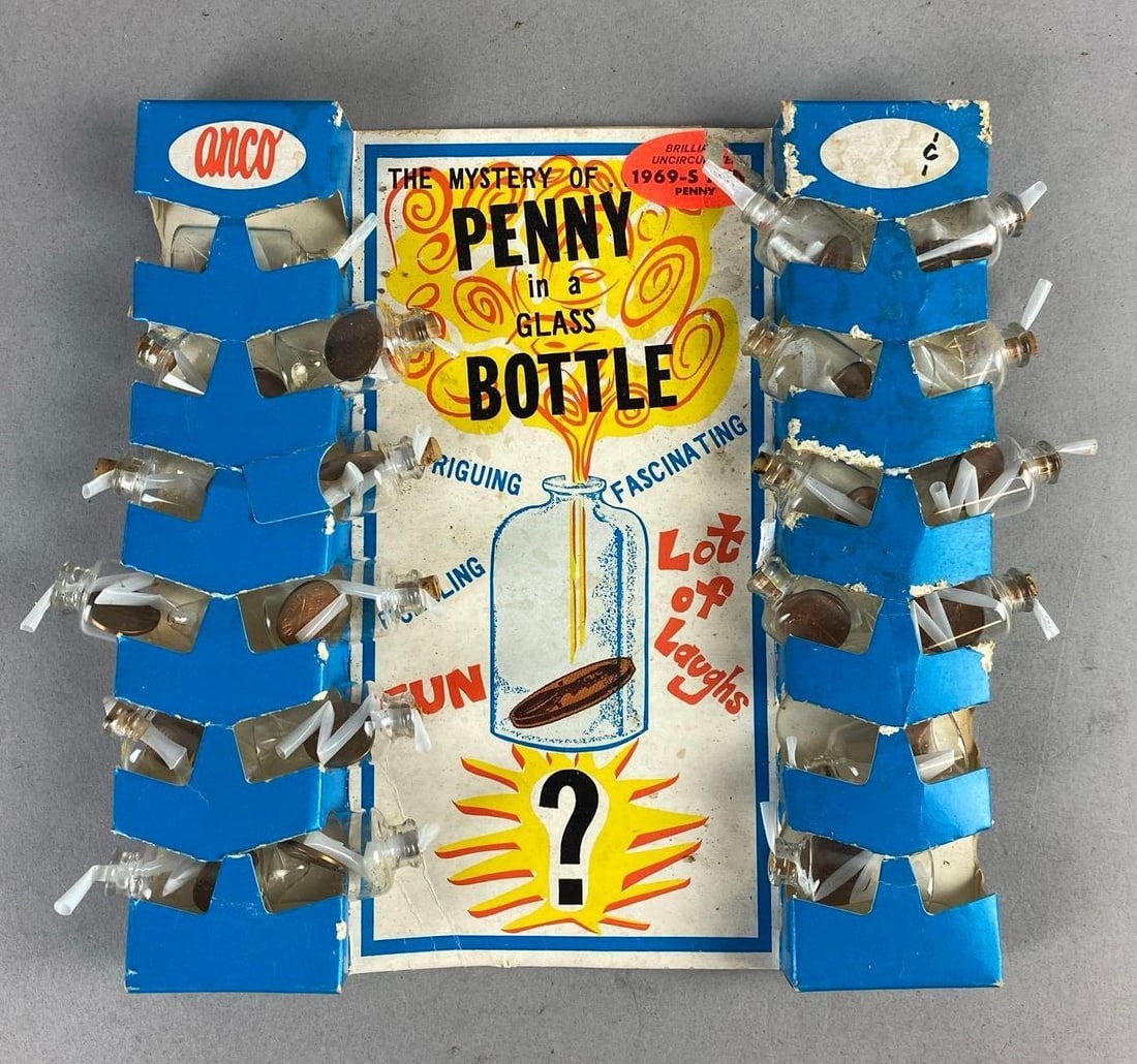 Vintage 1969 Anco Penny in a Glass Bottle Novelty: Incomplete set. Includes 1969 S mint Pennies. Measures L 9 x W 8 1/2 inches.