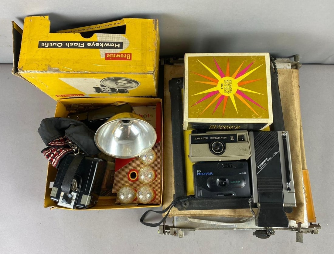 group of Assorted Vintage Film Cameras and more: Includes Kodak Brownie, Super 8 light gun, and more. Largest measures 12 x 8 inches.