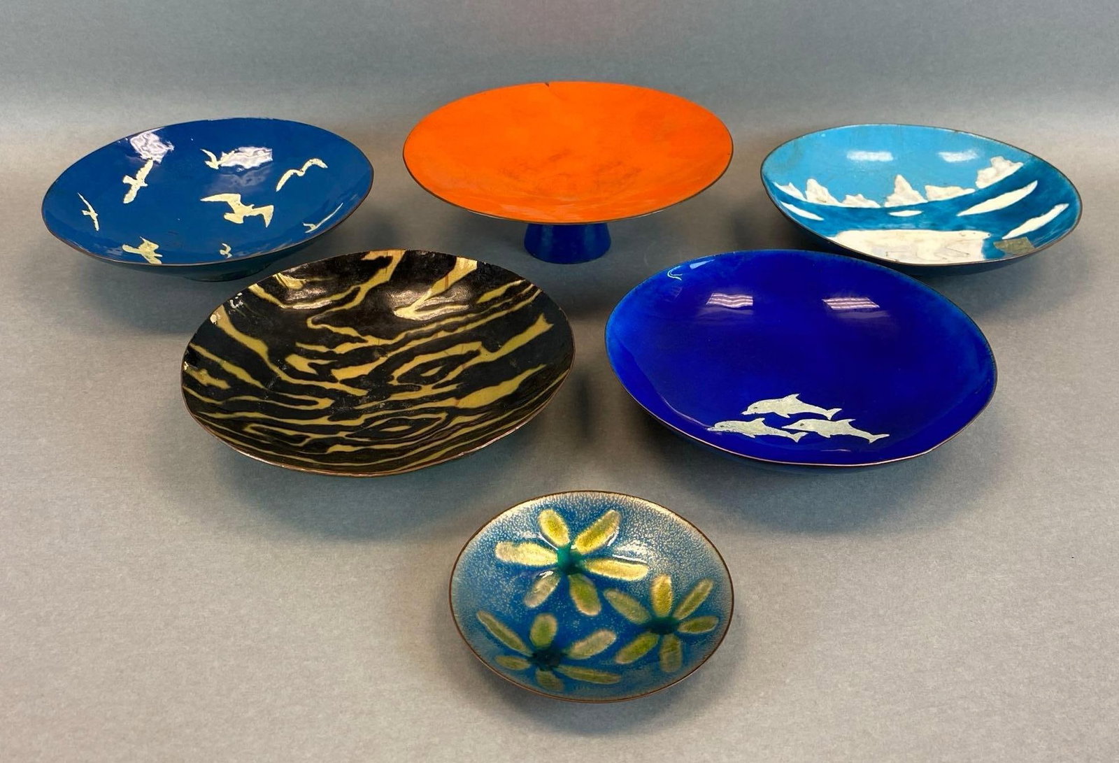 Group of 6 Metal Enamelware Bowls: 5 made by Claus Jensen and 1 made by Hilary, some chips shown on orange bowl, largest measures 2 3/4 x 8 x 8 inches