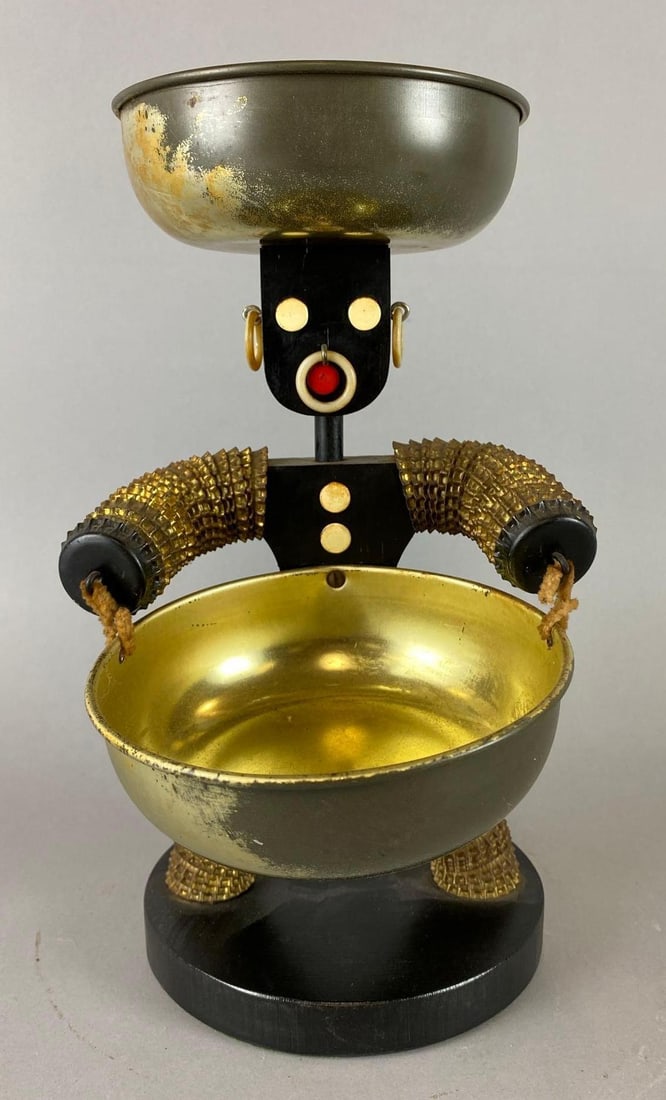 Vintage African Bottle Cap Man Figure: Bowls have some wear. Measures 11 x 6 1/4 x 8 1/4 inches.
