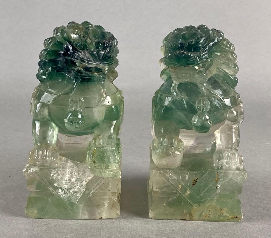 Pair of Glass Asian Foo Dog Figurines: Some chips throughout, Both measure 5 1/4 x 2 1/2 x 3 inches.