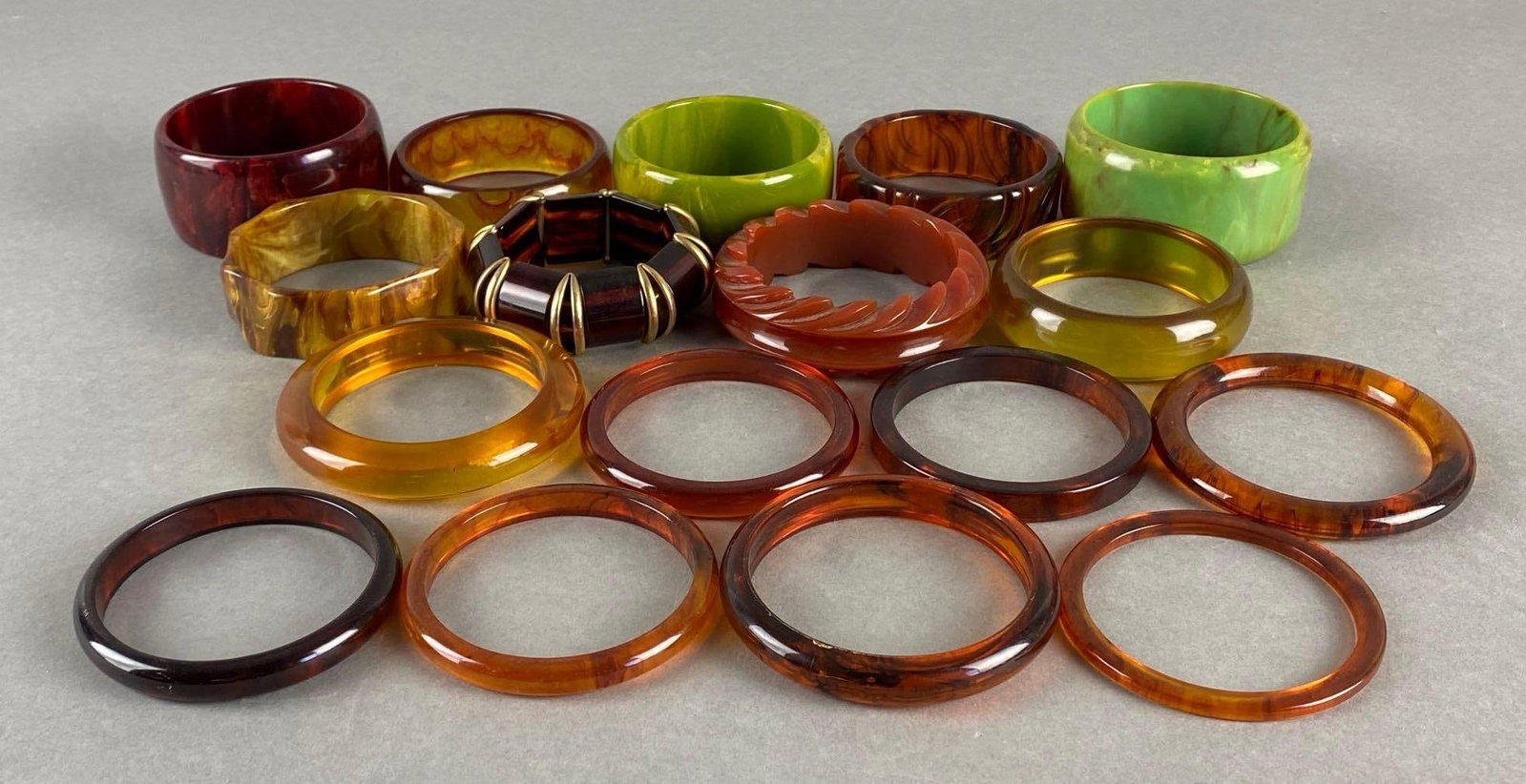 Group of 17 Plastic Bangle Bracelets: Largest measures 1 1/2 x 3 1/4 x 3 1/4 inches,