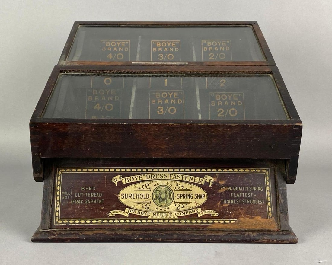 1919 Boye Needle Co Dress Fastener In Store Tabletop Wood Advertising Cabinet: Needs deep cleaning, scratches and stain wear shown, Measures 10 inches H x 11 1/2 inches W x 13 1/2 inches D