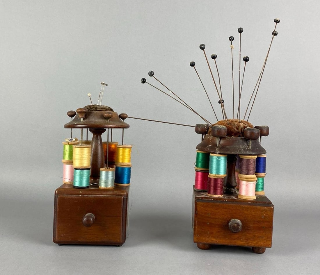 Group of 2 Antique Victorian Sewing Thread Spool Carousel Wood Standa: needs cleaning, each features variety of spools, needs and pins, largest measures 8 inches H x 4 inches W x 5 inches D