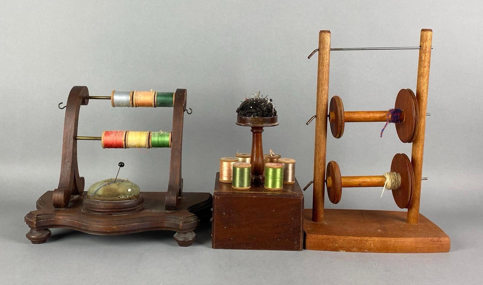 Group of 3 Antique Wood Thread Spool Caddys and Lazy Kate: Includes assorted threads and pins/needles, tallest measures 11 1/2 inches H x 7 1/2 inches W x 5 inches D