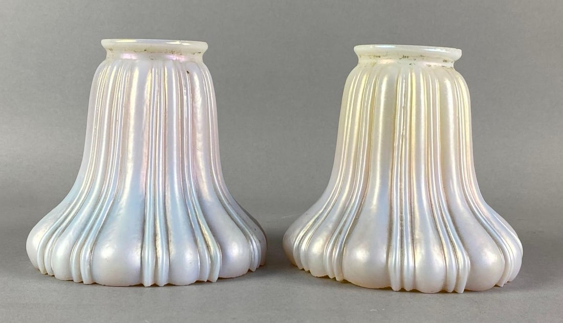 Group of 2 Antique Cased Gold Favrile Ribbed Glass Lamp Shades: Some fleabites on fitters, largest measures 4 3/4 inches H x 5 inches W with a 2 1/4 inches fitter