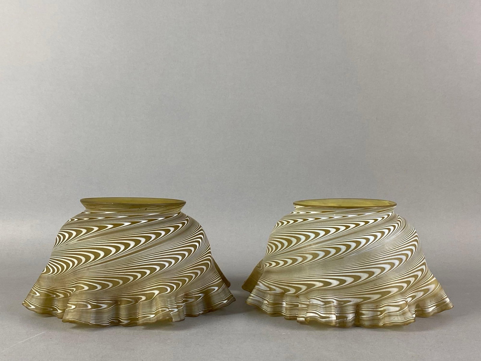 Group of 2 Frosted Pulled Swirl Yellow Art Glass Lamp Shades: both features ruffled ribboned edges, each measures 4 inches H x 7 inches W with a 4 inches fitter