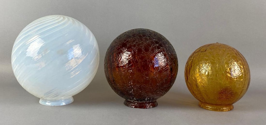 Group of 3 Antique Globe Art Glass Lamp Shades: Includes opalescent spiral and 2 amber crackle shades, largest measures 8 1/4 inches H x 7 1/2 inches W with a 3 inches fittee